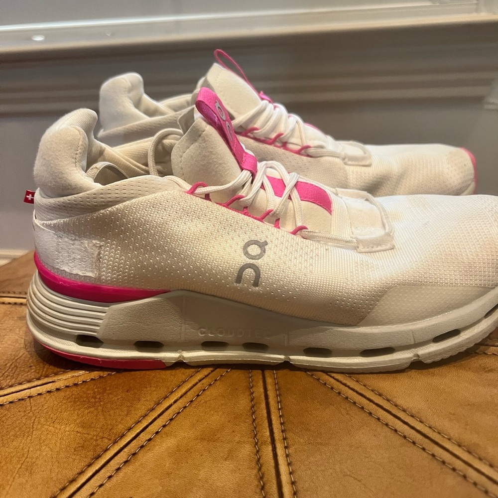 On Running White and Pink Sneakers with CloudTec Cushioning
